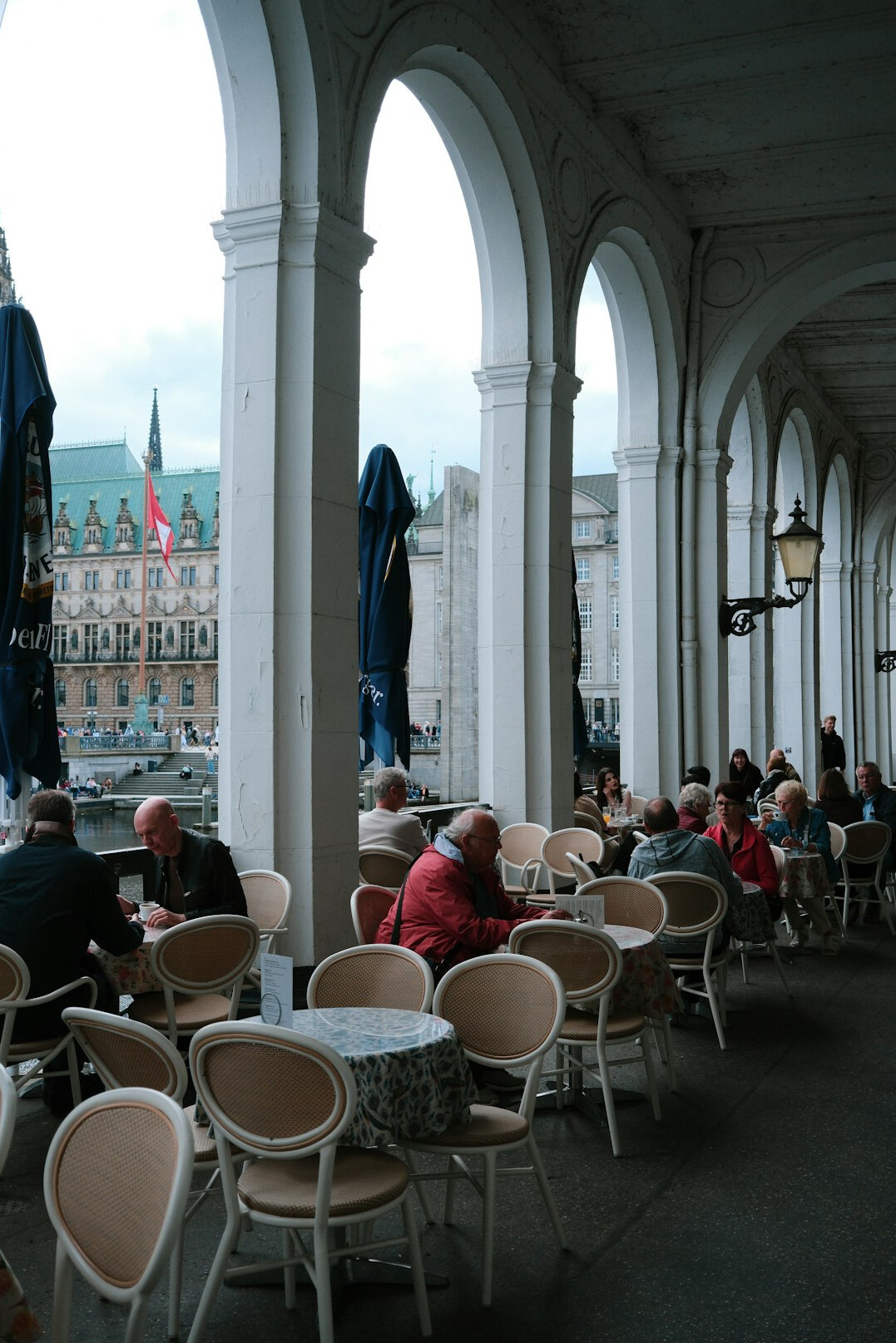 people sitting on urban terrace