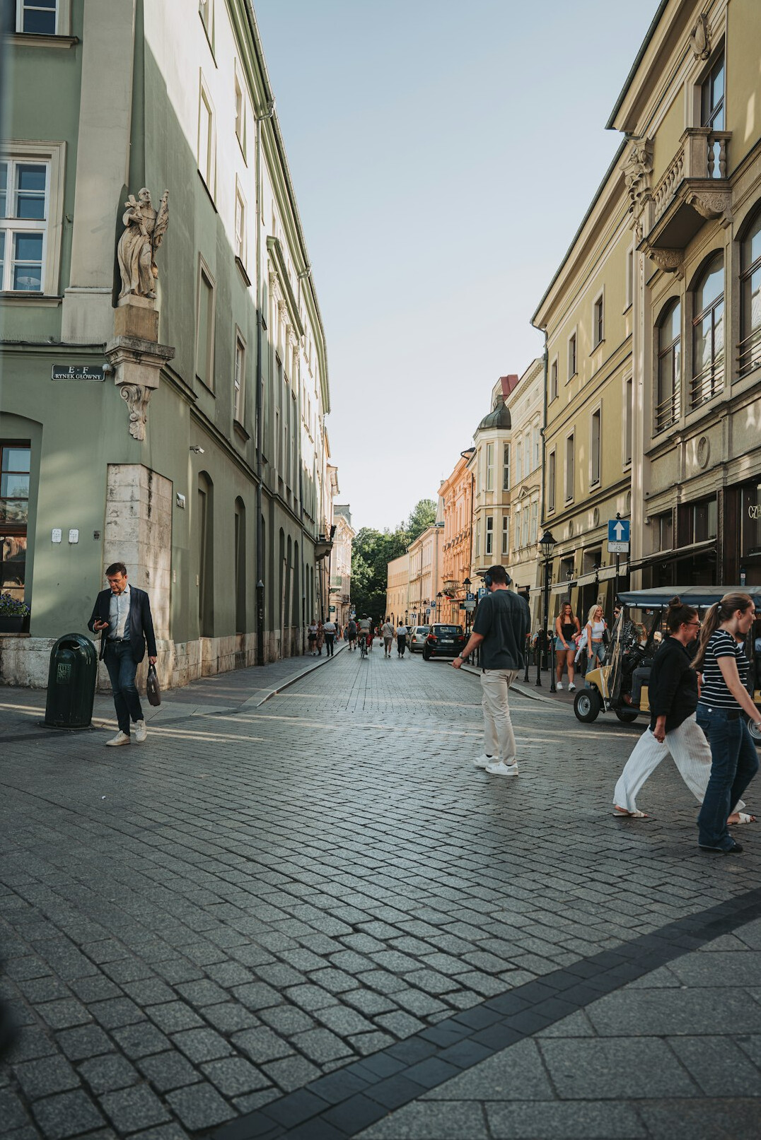 person walking on city street