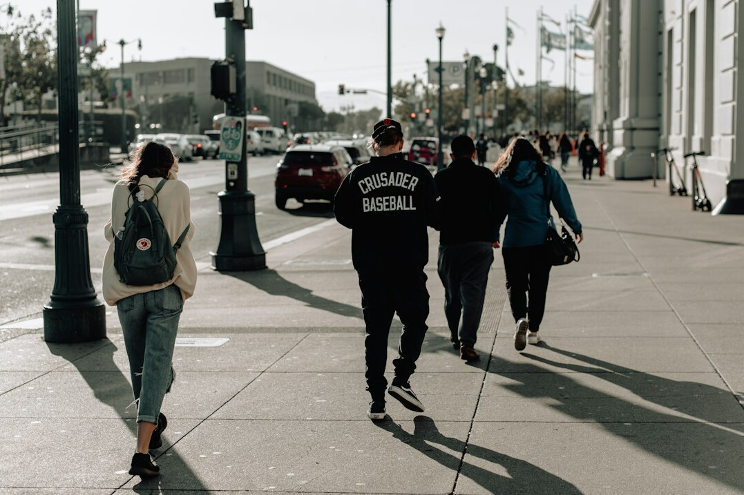 people commuting in city street